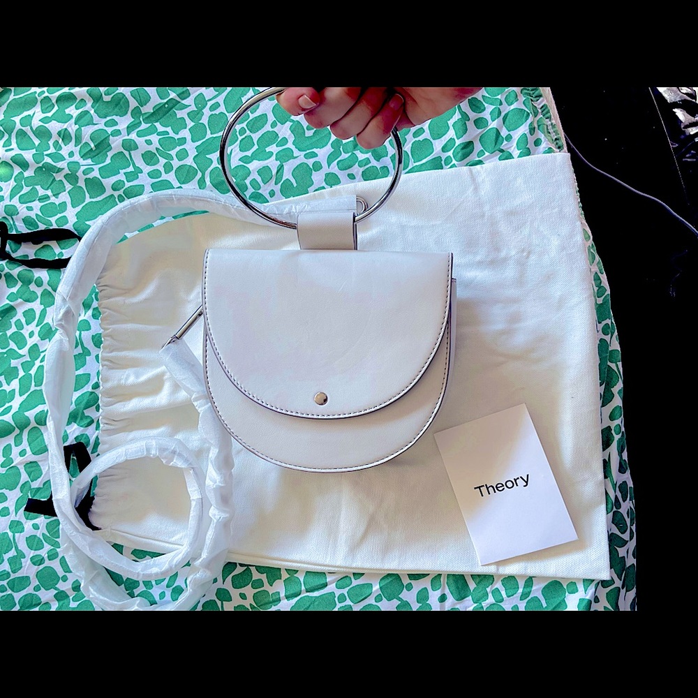 Nwt theory clutch with long strap for shoulder or crossbody wear.
